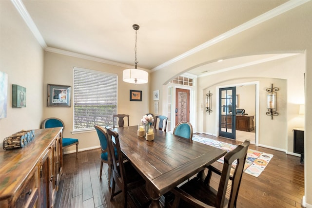 2510 Eagle Post Dr, Conroe, TX 77304 - dining room featuring arched walkways, dark wood-style flooring, ornamental molding, baseboards, and french doors