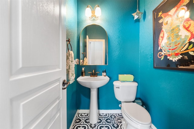 2510 Eagle Post Dr, Conroe, TX 77304 - half bath with toilet, tile patterned floors, and baseboards