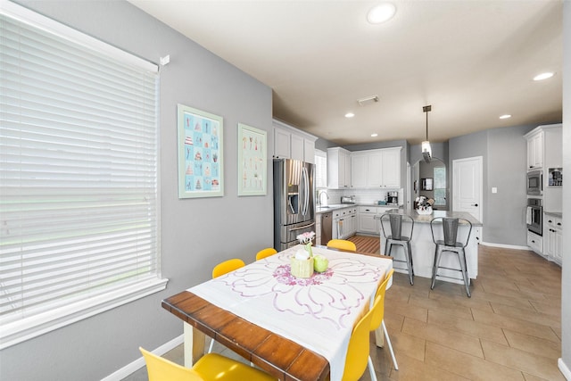 2510 Eagle Post Dr, Conroe, TX 77304 - dining room with recessed lighting, light tile patterned floors, and baseboards
