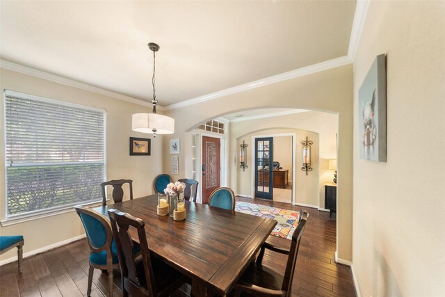 2510 Eagle Post Dr, Conroe, TX 77304 - dining room with arched walkways, ornamental molding, dark wood finished floors, and baseboards