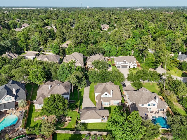 2510 Eagle Post Dr, Conroe, TX 77304 - aerial perspective of suburban area with a pool and a forest