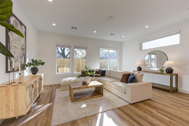 2704 Fox St, Houston, TX 77003 - living room featuring wood finished floors, recessed lighting, and baseboards