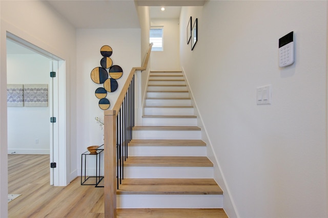 412 N Nagle St, Houston, TX 77003 - stairs with wood finished floors, baseboards, and recessed lighting