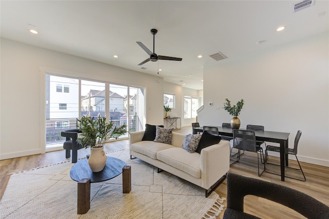 412 N Nagle St, Houston, TX 77003 - living room with a ceiling fan, light wood finished floors, baseboards, and recessed lighting