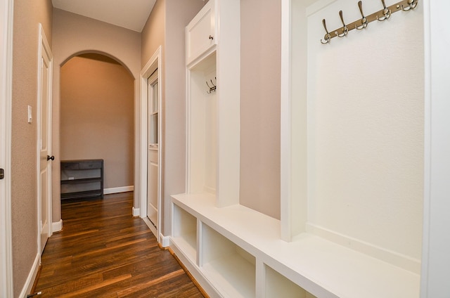705 Seydler St, East Bernard, TX 77435 - mudroom with arched walkways, dark wood-style flooring, and baseboards