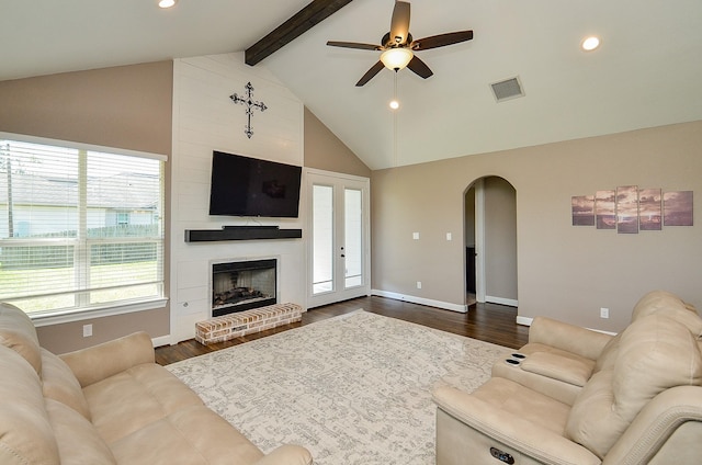 705 Seydler St, East Bernard, TX 77435 - living room with ceiling fan, arched walkways, recessed lighting, dark wood-type flooring, and a large fireplace