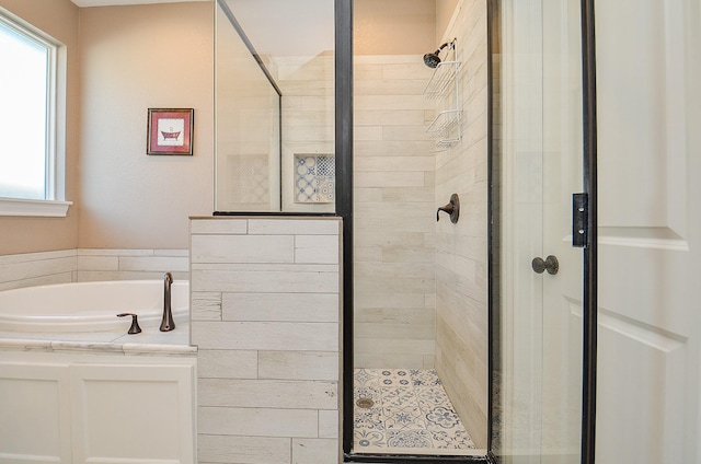 705 Seydler St, East Bernard, TX 77435 - bathroom with a shower stall, healthy amount of natural light, and a garden tub