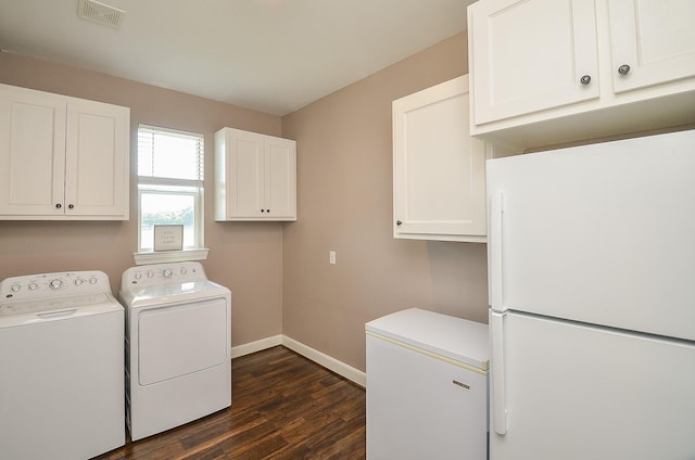 705 Seydler St, East Bernard, TX 77435 - laundry room featuring cabinet space, washer and clothes dryer, baseboards, and dark wood-style floors