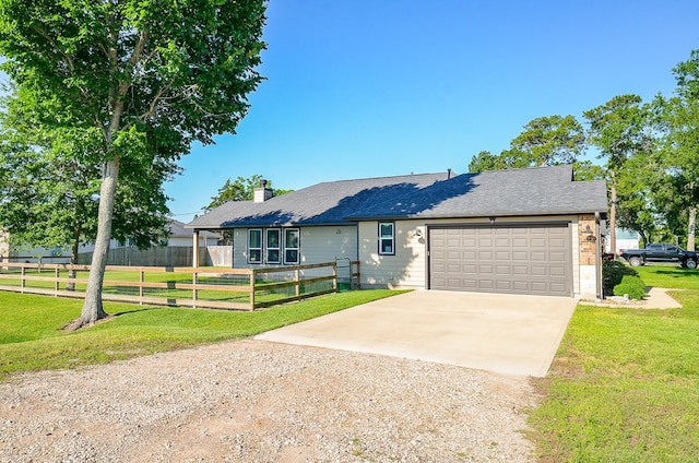 705 Seydler St, East Bernard, TX 77435 - view of front of home featuring concrete driveway, a garage, a chimney, and roof with shingles