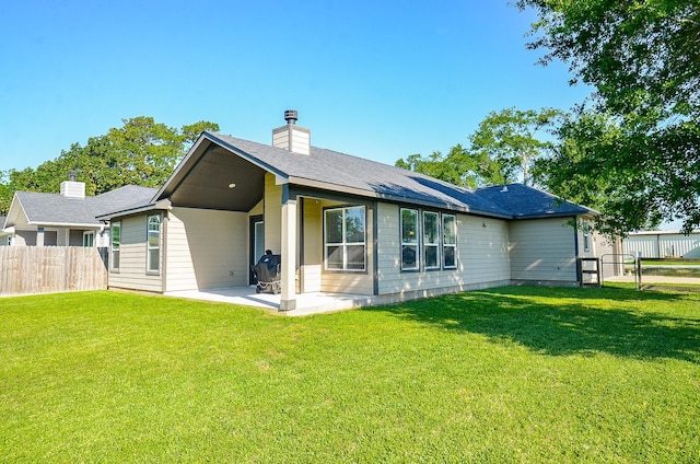705 Seydler St, East Bernard, TX 77435 - back of house with a patio and a chimney