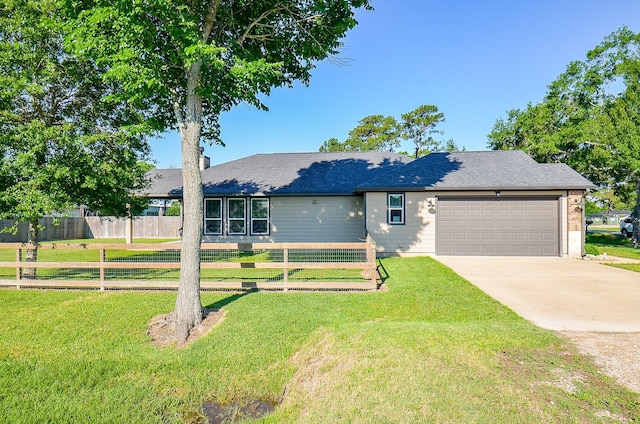 705 Seydler St, East Bernard, TX 77435 - view of front of home featuring a garage, driveway, and roof with shingles