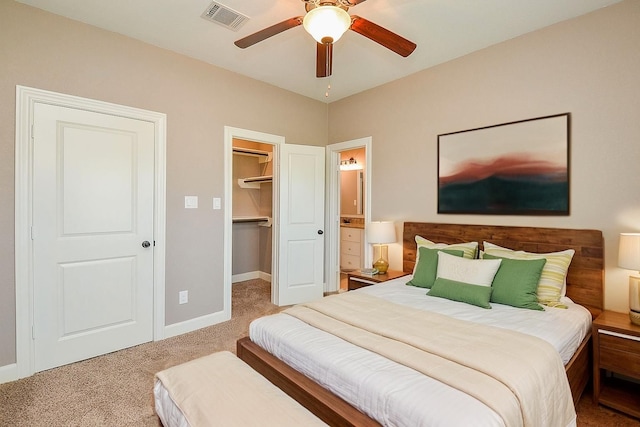 705 Seydler St, East Bernard, TX 77435 - bedroom featuring carpet flooring, a spacious closet, baseboards, a closet, and ceiling fan