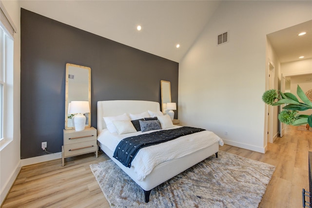 2708 Fox St, Houston, TX 77003 - bedroom with high vaulted ceiling, recessed lighting, light wood finished floors, and baseboards