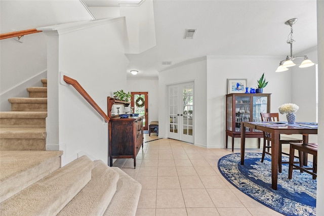 10826 Redstone Ct, Missouri City, TX 77459 - entryway with ornamental molding, stairway, light tile patterned floors, french doors, and a chandelier