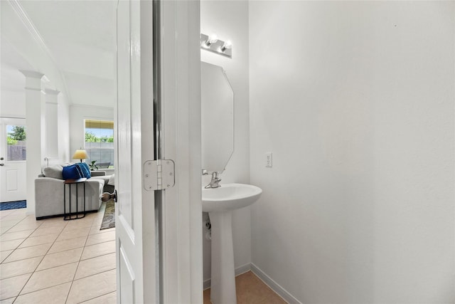 10826 Redstone Ct, Missouri City, TX 77459 - bathroom featuring tile patterned flooring, crown molding, and baseboards