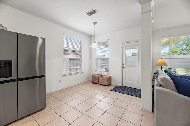 10826 Redstone Ct, Missouri City, TX 77459 - entryway with healthy amount of natural light, light tile patterned floors, baseboards, and ornamental molding