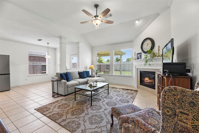 10826 Redstone Ct, Missouri City, TX 77459 - tiled living room with crown molding, ceiling fan, a tile fireplace, baseboards, and lofted ceiling
