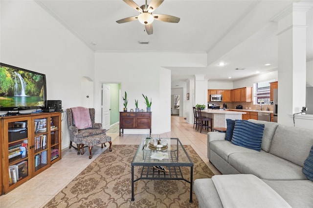 10826 Redstone Ct, Missouri City, TX 77459 - living area featuring crown molding, light tile patterned floors, a ceiling fan, decorative columns, and recessed lighting