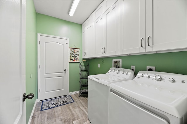 10826 Redstone Ct, Missouri City, TX 77459 - clothes washing area with cabinet space, washing machine and dryer, light wood-style floors, and baseboards