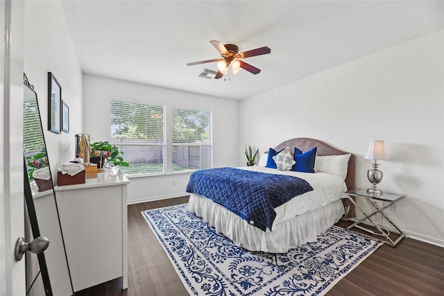 10826 Redstone Ct, Missouri City, TX 77459 - bedroom with baseboards, dark wood-type flooring, and ceiling fan