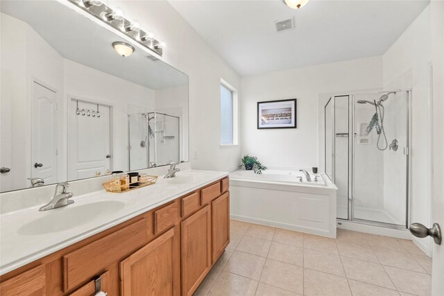 10826 Redstone Ct, Missouri City, TX 77459 - full bath featuring tile patterned floors, a shower stall, a garden tub, and double vanity