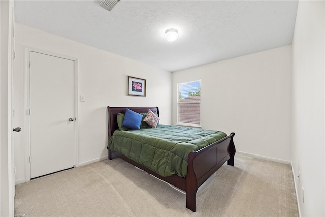 10826 Redstone Ct, Missouri City, TX 77459 - bedroom with light colored carpet, baseboards, and a textured ceiling