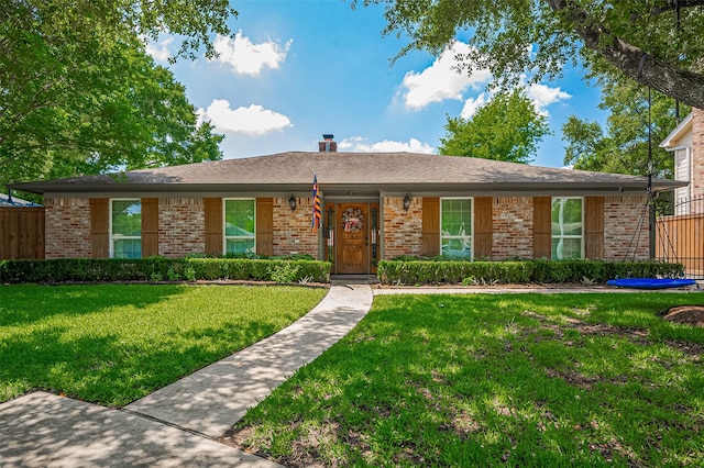 ranch-style home featuring brick siding
