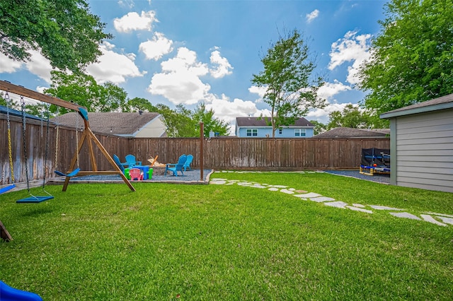 view of yard with an outdoor fire pit and a patio