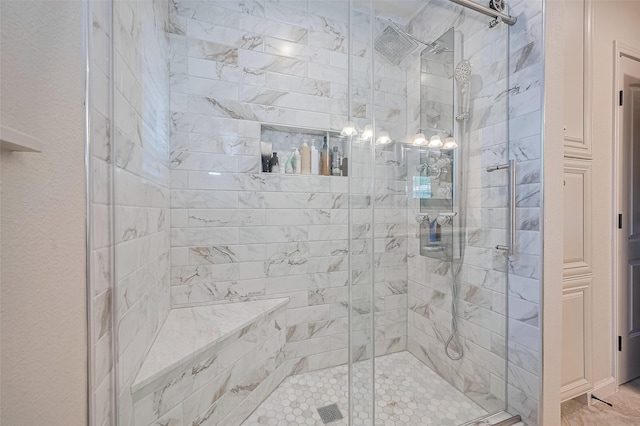 bathroom with a shower stall
