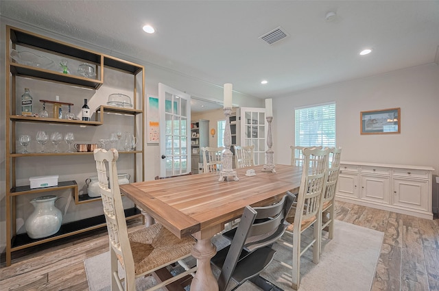 dining area featuring light wood-style flooring, french doors, and recessed lighting