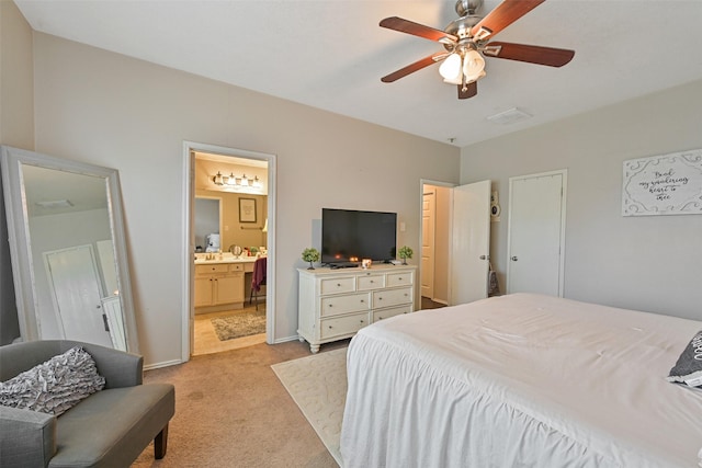 2910 Meridian Bay Ln, Dickinson, TX 77539 - bedroom featuring light colored carpet, ensuite bathroom, ceiling fan, and baseboards