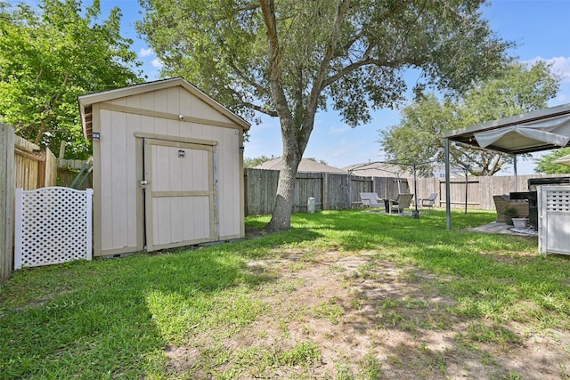 2910 Meridian Bay Ln, Dickinson, TX 77539 - view of yard featuring a storage unit and an outdoor structure
