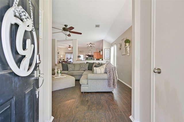 2910 Meridian Bay Ln, Dickinson, TX 77539 - living room with ceiling fan, dark wood-style flooring, lofted ceiling, and baseboards