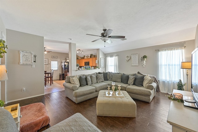 2910 Meridian Bay Ln, Dickinson, TX 77539 - living area with ceiling fan, dark wood-style floors, and a textured ceiling