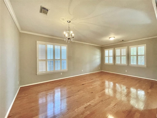 15238 Ledgewood Park Dr, Cypress, TX 77429 - spare room with a chandelier, crown molding, wood finished floors, and baseboards