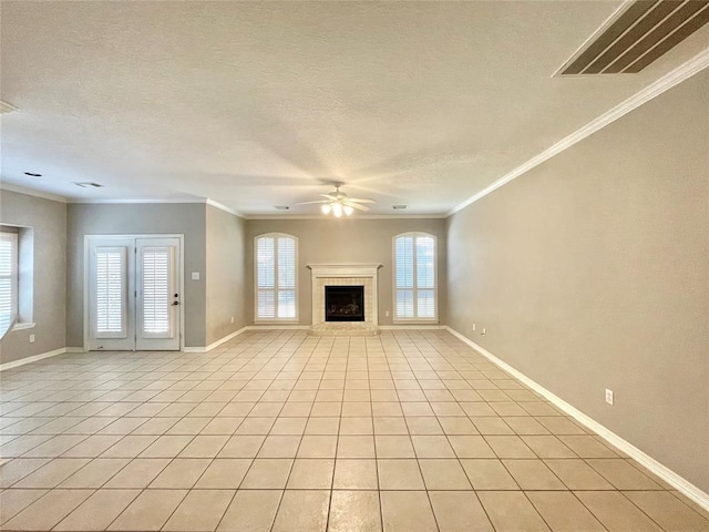 15238 Ledgewood Park Dr, Cypress, TX 77429 - unfurnished living room with healthy amount of natural light, a ceiling fan, ornamental molding, baseboards, and a fireplace with raised hearth
