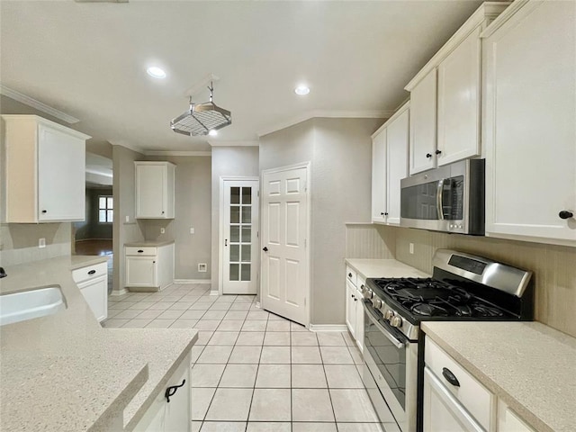15238 Ledgewood Park Dr, Cypress, TX 77429 - kitchen with stainless steel appliances, crown molding, a sink, light tile patterned floors, and recessed lighting