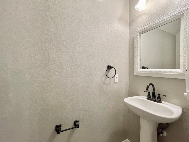 15238 Ledgewood Park Dr, Cypress, TX 77429 - bathroom featuring a sink and a textured wall