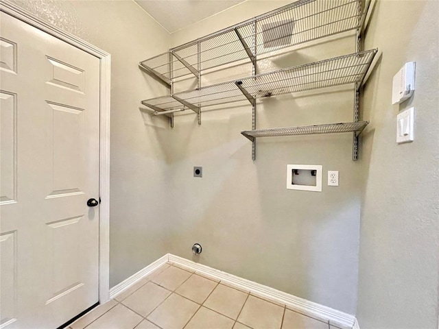 15238 Ledgewood Park Dr, Cypress, TX 77429 - clothes washing area featuring hookup for an electric dryer, hookup for a washing machine, tile patterned floors, and baseboards