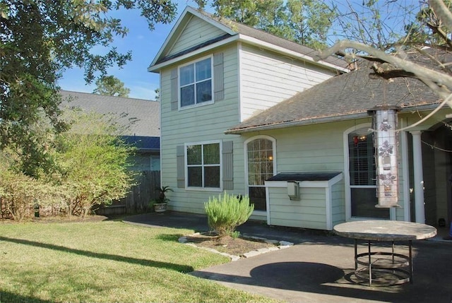 15238 Ledgewood Park Dr, Cypress, TX 77429 - back of house with a shingled roof and a patio