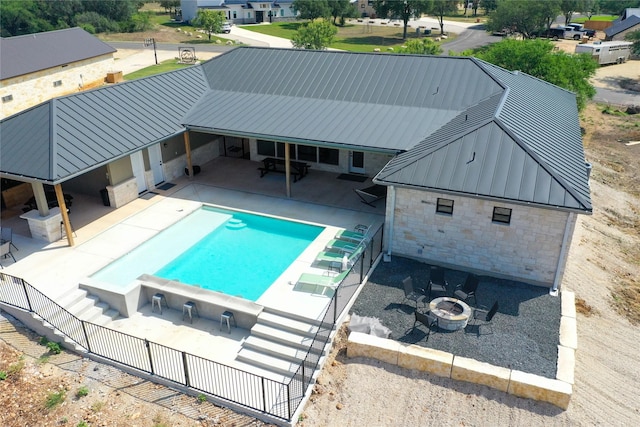 1463 Mountain Valley Dr, Concan, TX 78838 - outdoor pool with a fire pit and a patio area