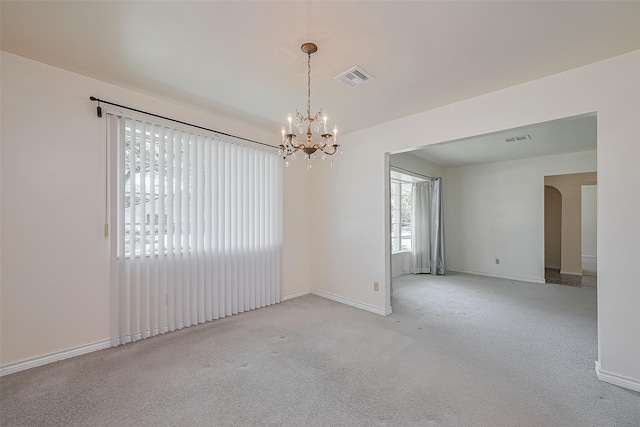 7827 Braesdale Ln, Houston, TX 77071 - carpeted empty room featuring a chandelier, baseboards, and arched walkways