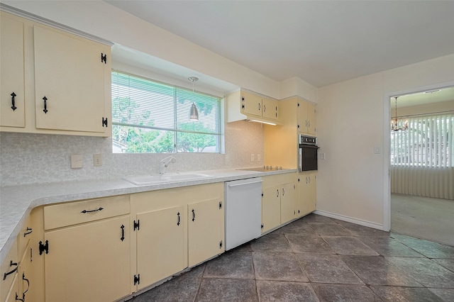 7827 Braesdale Ln, Houston, TX 77071 - kitchen featuring dishwasher, oven, a sink, cream cabinets, and tasteful backsplash