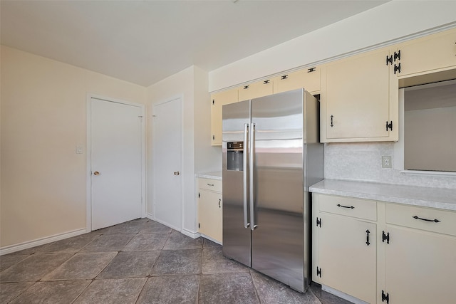 7827 Braesdale Ln, Houston, TX 77071 - kitchen featuring stainless steel fridge, light countertops, and cream cabinetry