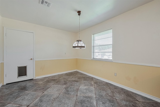 7827 Braesdale Ln, Houston, TX 77071 - unfurnished dining area featuring baseboards, stone finish floors, and a chandelier
