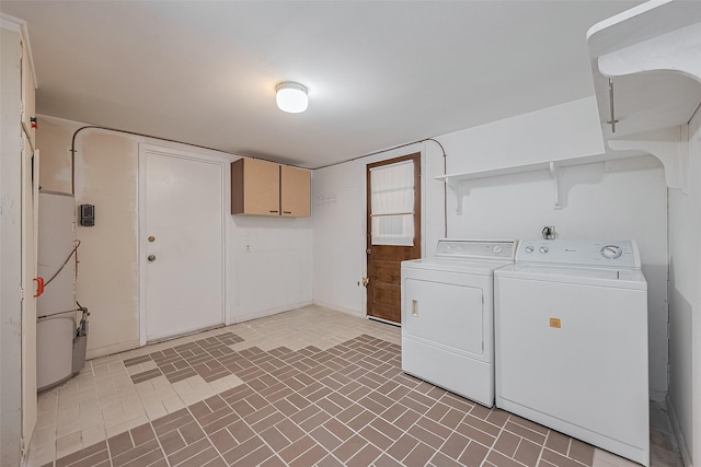 7827 Braesdale Ln, Houston, TX 77071 - washroom featuring separate washer and dryer, brick patterned flooring, and baseboards