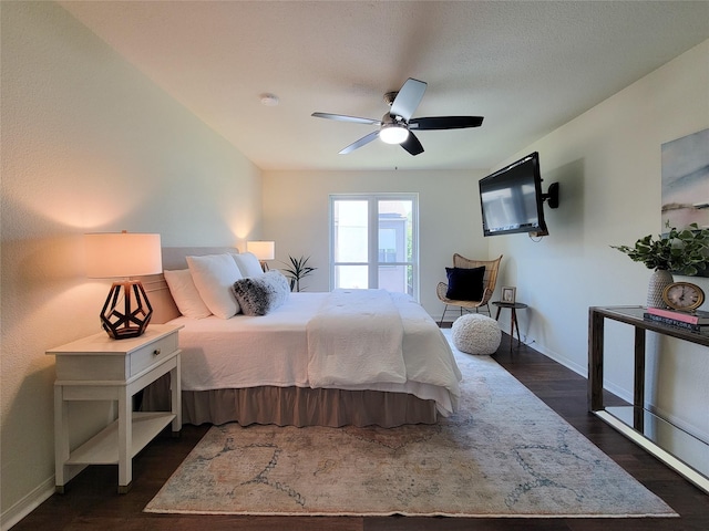 1201 Bering Dr Unit 44, Houston, TX 77057 - bedroom with dark wood-style flooring, baseboards, and a ceiling fan