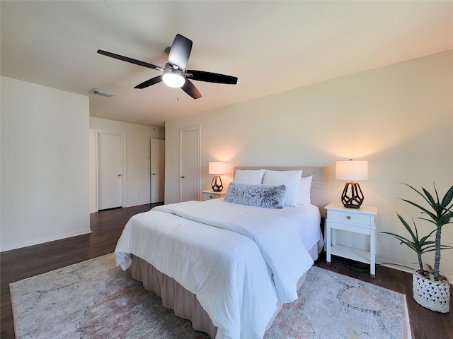 1201 Bering Dr Unit 44, Houston, TX 77057 - bedroom featuring wood finished floors, ceiling fan, and baseboards