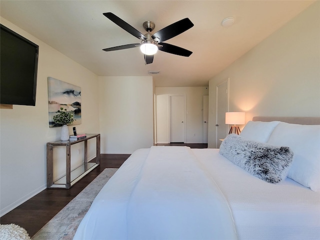 1201 Bering Dr Unit 44, Houston, TX 77057 - bedroom featuring dark wood-style floors, baseboards, and ceiling fan
