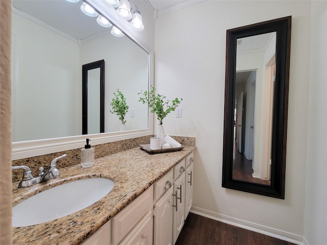 1201 Bering Dr Unit 44, Houston, TX 77057 - bathroom featuring wood finished floors, crown molding, vanity, and baseboards